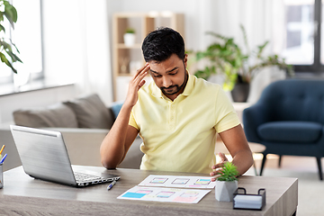 Image showing ui designer working on user interface at home