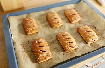 Image showing baking tray with jam pies at home kitchen