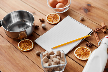 Image showing notebook, pencil, ingredients for eggnog cooking