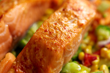 Image showing close up of baked salmon fish with vegetables