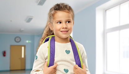 Image showing happy little girl with backpack at school