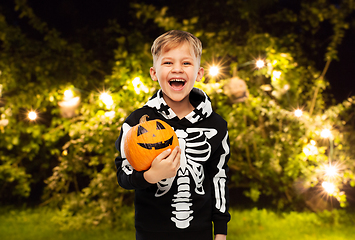 Image showing happy boy in halloween costume with jack-o-lantern