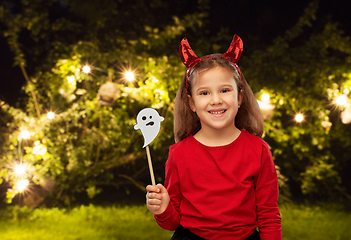 Image showing girl in halloween costume with ghost party prop