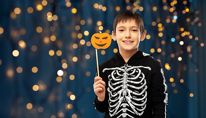 Image showing boy in halloween costume of skeleton with pumpkin