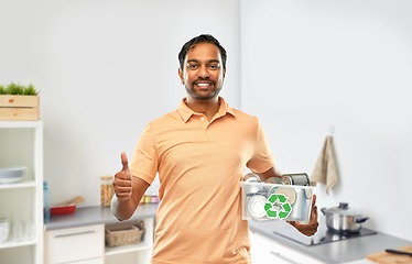 Image showing smiling young indian man sorting metallic waste