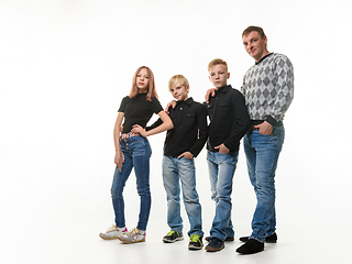 Image showing Dad, two sons and daughter in casual clothes in dark colors, full length portrait, white background