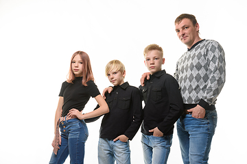 Image showing Dad, two sons and a daughter in casual clothes in dark colors, white background