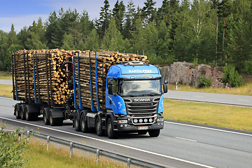 Image showing Blue Scania Logging Truck Hauls Pulp Wood