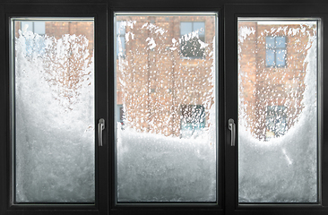 Image showing window glass covered with snow in winter