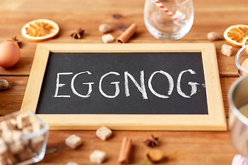 Image showing eggnog word on chalkboard, ingredients and spices