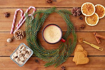 Image showing cup of eggnog, fir branches, gingerbread and sugar