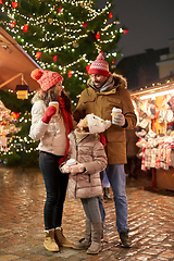 Image showing family with takeaway drinks at christmas market