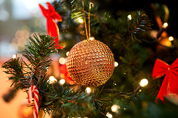 Image showing golden christmas ball decoration on fir tree