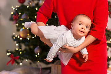 Image showing mother with happy baby daughter at christmas tree