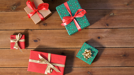 Image showing christmas gifts on wooden boards