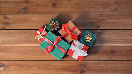 Image showing christmas gifts on wooden boards