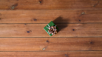 Image showing christmas gift on wooden boards