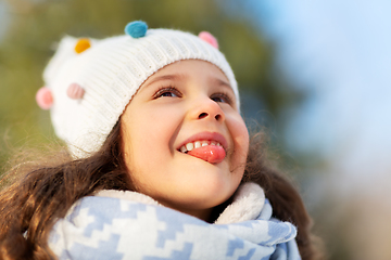 Image showing happy little girl having fun at winter park