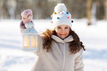 Image showing happy little girl with christmas lantern in winter