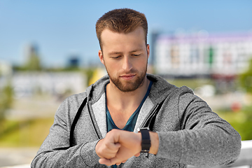 Image showing man with fitness tracker in city