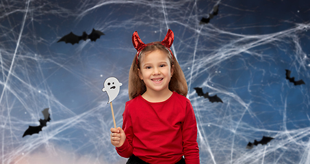 Image showing girl in halloween costume with ghost party prop