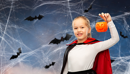 Image showing girl in halloween costume of dracula with pumpkin