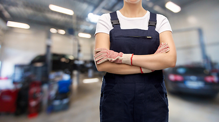 Image showing close up of female worker at car service