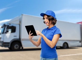 Image showing happy smiling delivery girl with tablet computer