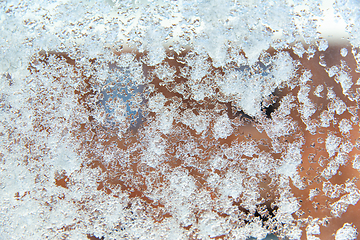 Image showing window glass covered with snow in winter