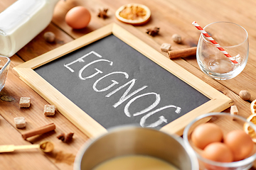 Image showing eggnog word on chalkboard, ingredients and spices