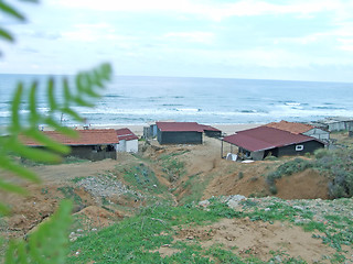 Image showing old shacks by the beach