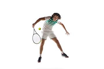 Image showing Young caucasian professional sportsman playing tennis isolated on white background