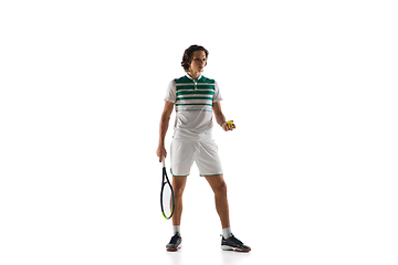 Image showing Young caucasian professional sportsman playing tennis isolated on white background