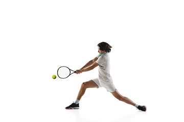 Image showing Young caucasian professional sportsman playing tennis isolated on white background