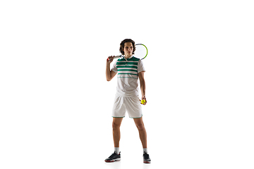 Image showing Young caucasian professional sportsman playing tennis isolated on white background