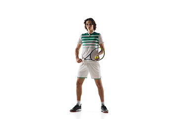 Image showing Young caucasian professional sportsman playing tennis isolated on white background