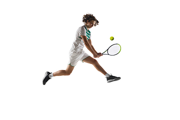 Image showing Young caucasian professional sportsman playing tennis isolated on white background