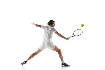 Image showing Young caucasian professional sportsman playing tennis isolated on white background