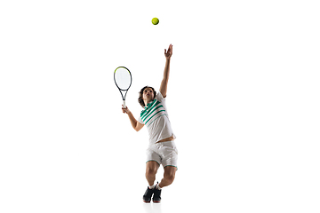 Image showing Young caucasian professional sportsman playing tennis isolated on white background