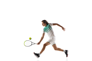 Image showing Young caucasian professional sportsman playing tennis isolated on white background