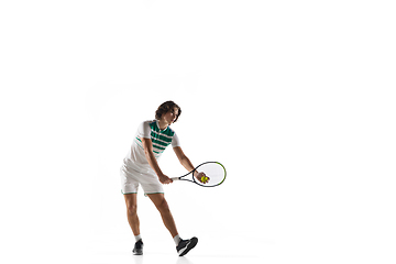 Image showing Young caucasian professional sportsman playing tennis isolated on white background