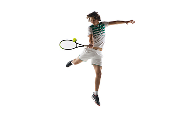 Image showing Young caucasian professional sportsman playing tennis isolated on white background