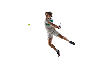 Image showing Young caucasian professional sportsman playing tennis isolated on white background