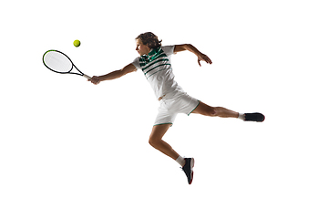 Image showing Young caucasian professional sportsman playing tennis isolated on white background