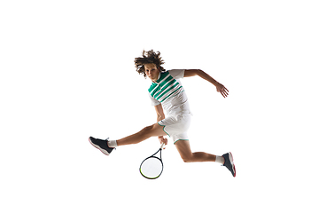 Image showing Young caucasian professional sportsman playing tennis isolated on white background