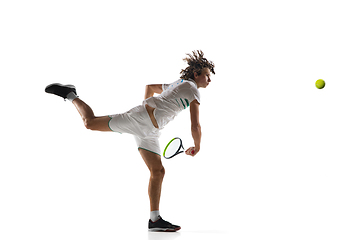 Image showing Young caucasian professional sportsman playing tennis isolated on white background