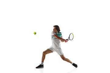 Image showing Young caucasian professional sportsman playing tennis isolated on white background