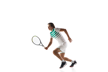 Image showing Young caucasian professional sportsman playing tennis isolated on white background