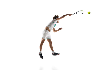 Image showing Young caucasian professional sportsman playing tennis isolated on white background