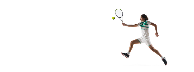 Image showing Young caucasian professional sportsman playing tennis isolated on white background